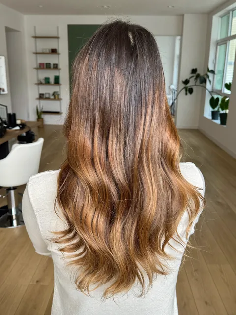 Soft balayage with loose, polished waves