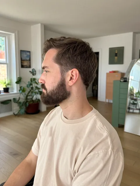 Sculpted full beard with a taper
